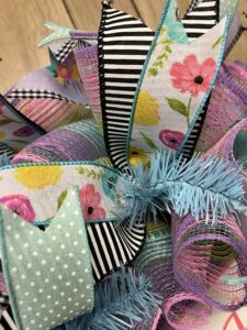 close up of spring ribbons in purple, pink and teal