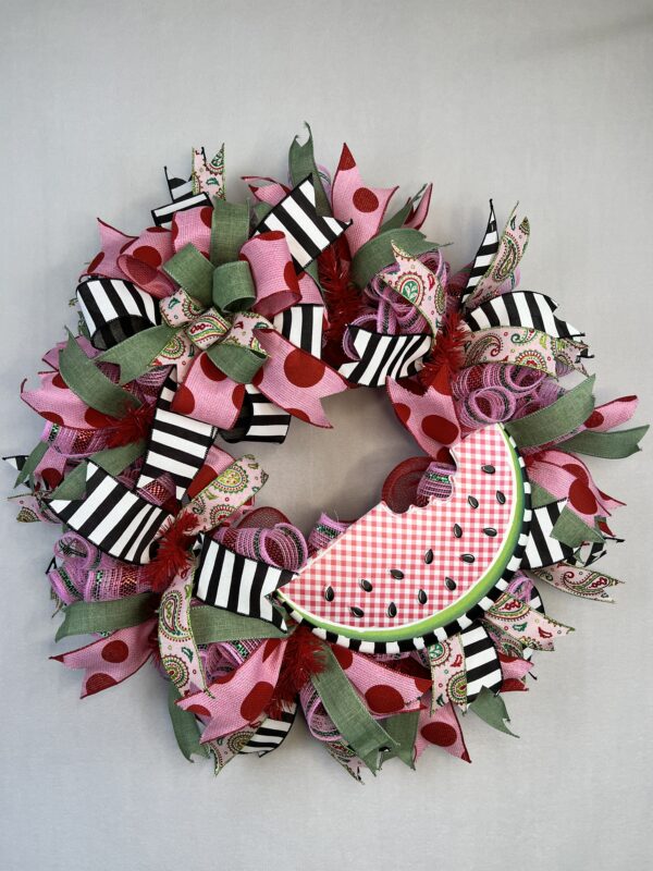 summer watermelon deco mesh wreath, slice of watermelon sign with paisley pink and green golors, red and pink large polka dot ribbon, black and white striped ribbon, green ribbon with pinks and red deco mesh