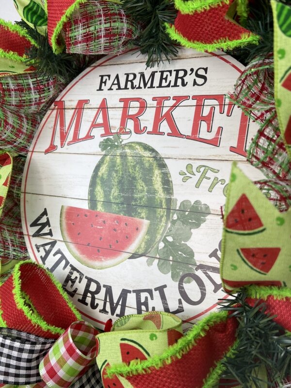 Introducing our delightful Farmer's Market Watermelon Wreath – a cheerful embodiment of the vibrant colors and flavors of summertime. This wreath not only brings the essence of a bountiful farmers' market to your doorstep but also adds a touch of whimsy to your seasonal decor.