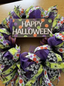 Happy halloween wreath with lots of fun halloween ribbons and sign