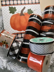WreathSupplies Subscription Box with fall pumkinsign, fall colored ribbons,orange/black/white deco mesh, white tinsel tie wreath work frame