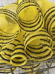 yellow with black border deco mesh pieces cut for bee hive wreath