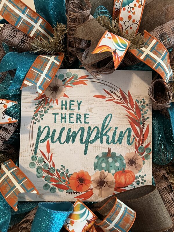 fall wreath with hey there pumpkin sign, pumpkin plaid and teal sprkly ribbons and big beautiful bow